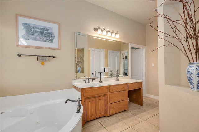 bathroom featuring tile patterned floors, vanity, and a tub