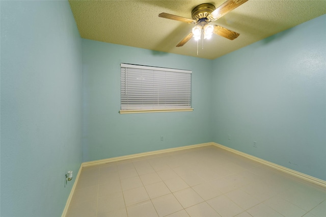 empty room with a textured ceiling and ceiling fan