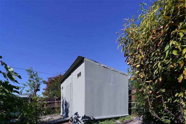 view of home's exterior featuring a shed