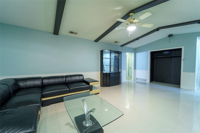 living room with ceiling fan and lofted ceiling with beams