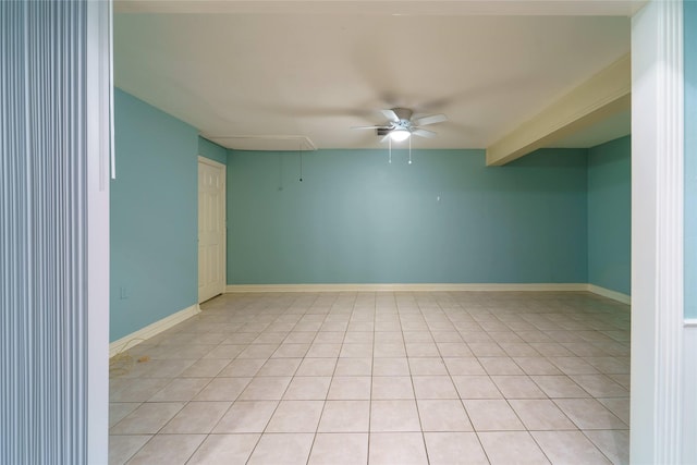 unfurnished room featuring beamed ceiling and ceiling fan