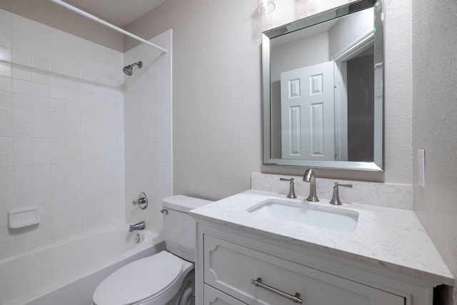 full bathroom with vanity, toilet, and tiled shower / bath