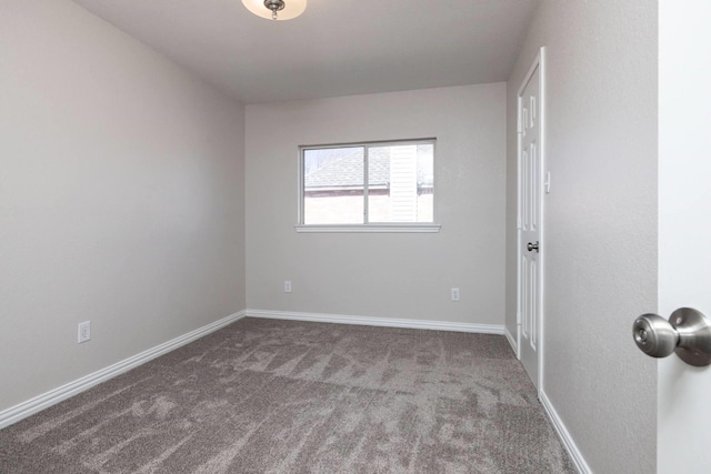 spare room with carpet flooring and baseboards