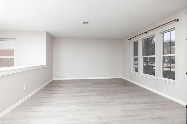 empty room with light wood-type flooring