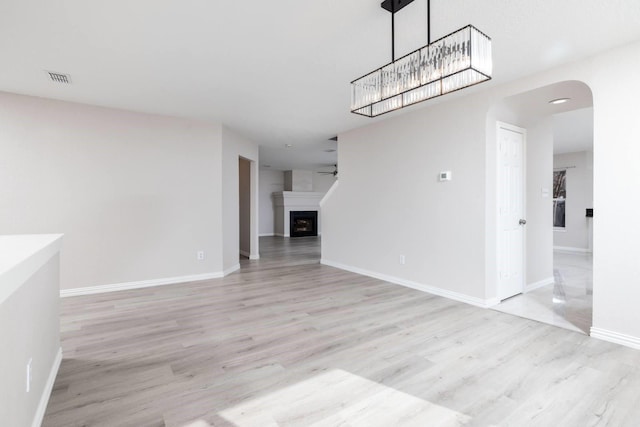 unfurnished dining area with light hardwood / wood-style flooring