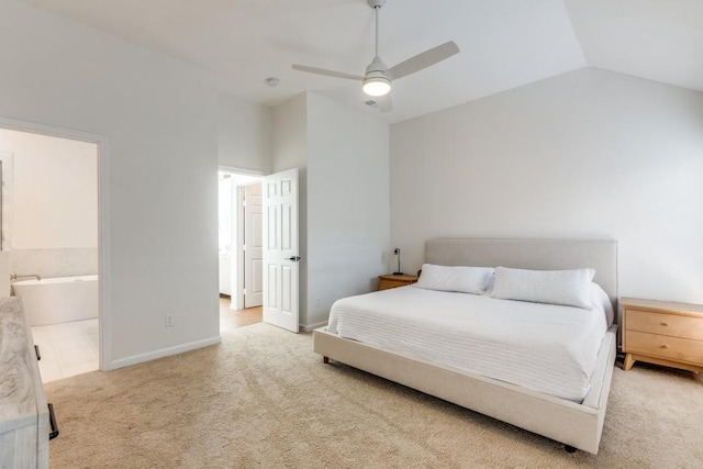 carpeted bedroom with lofted ceiling, ceiling fan, and ensuite bathroom