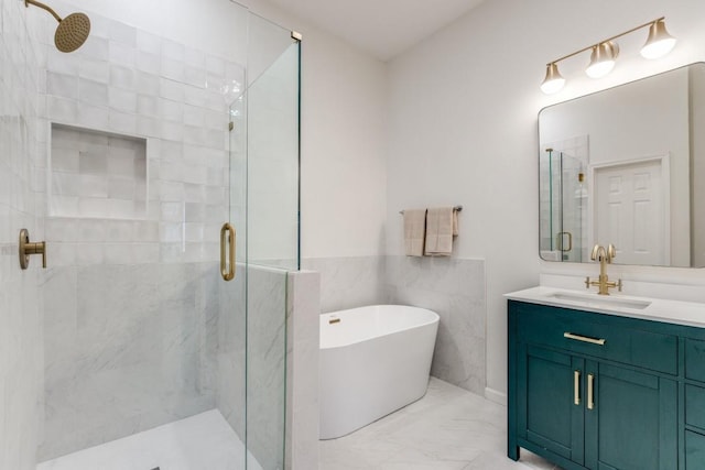 bathroom featuring vanity and shower with separate bathtub