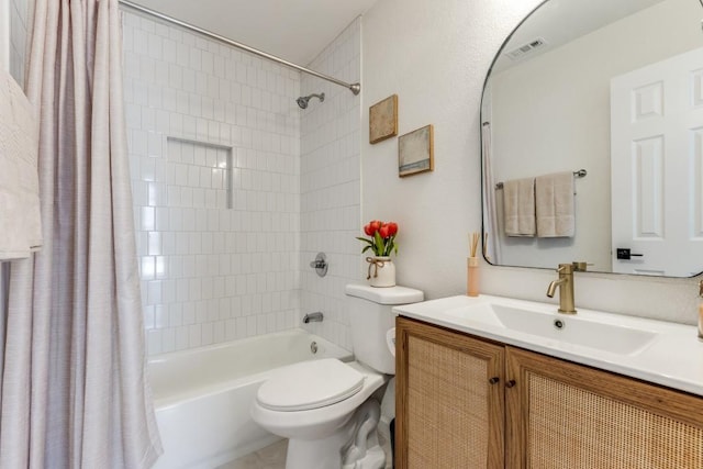 full bathroom with vanity, toilet, and shower / bath combo with shower curtain