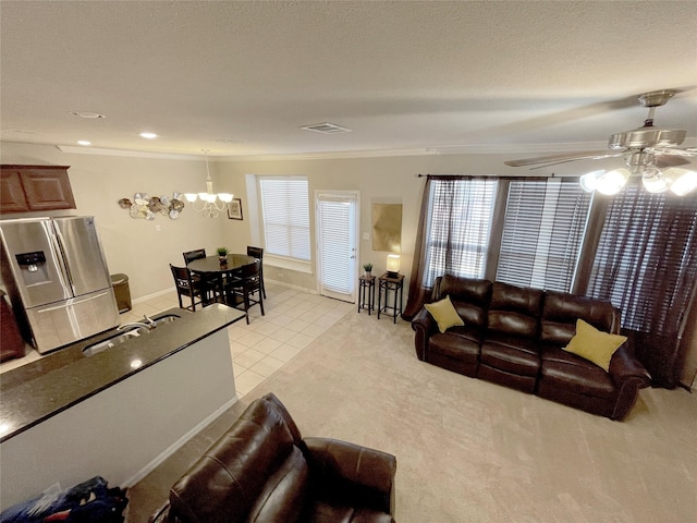 4155 Nia Dr, Irving, TX 75038 - living room featuring ceiling fan, ornamental molding, a chandelier, and light tile patterned floors