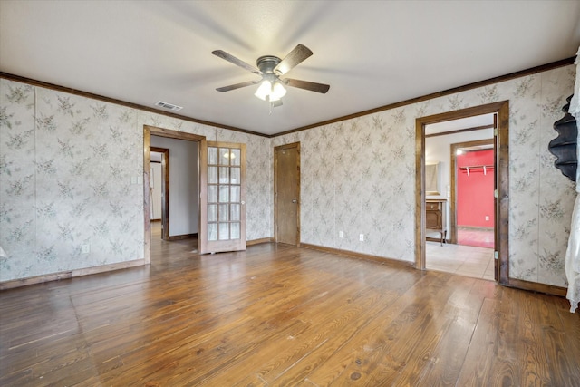 unfurnished room with french doors, ceiling fan, ornamental molding, and hardwood / wood-style floors