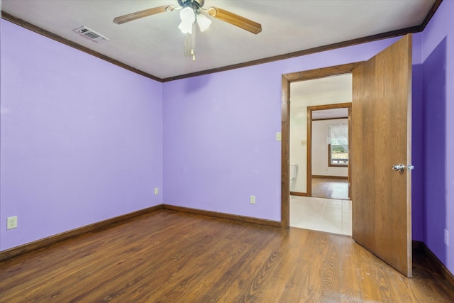 unfurnished room with ceiling fan, ornamental molding, and light hardwood / wood-style flooring