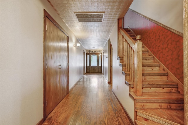 hallway featuring hardwood / wood-style flooring