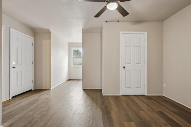 spare room featuring ceiling fan and dark hardwood / wood-style flooring