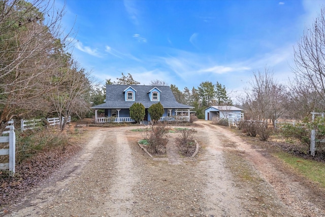 new england style home with covered porch