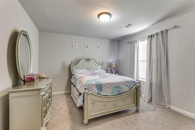 bedroom featuring light colored carpet