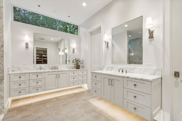 bathroom with vanity and a shower