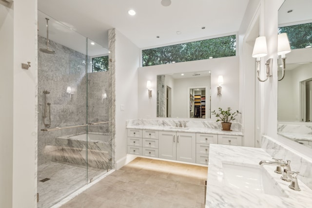 bathroom featuring vanity and a shower with shower door