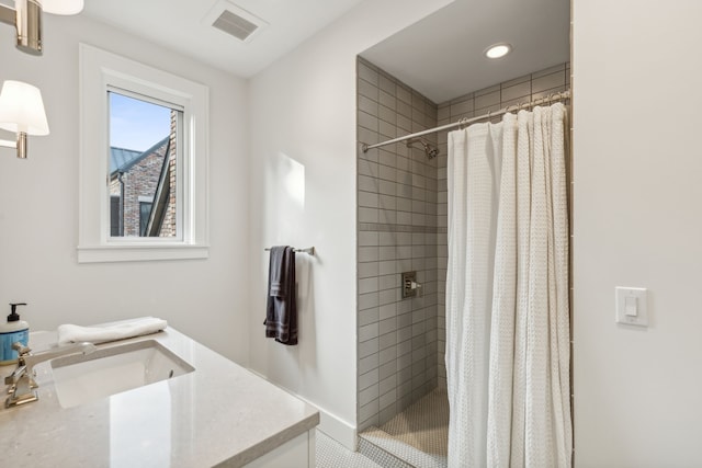 bathroom featuring vanity and a shower with shower curtain