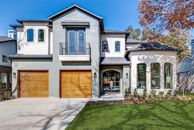 view of front of home featuring a garage and a front lawn