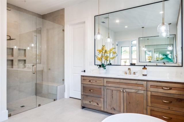 bathroom with vanity and a shower with shower door