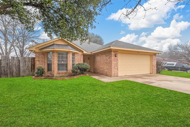 single story home with a garage and a front lawn