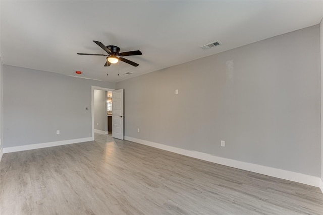 spare room featuring ceiling fan and light wood-type flooring