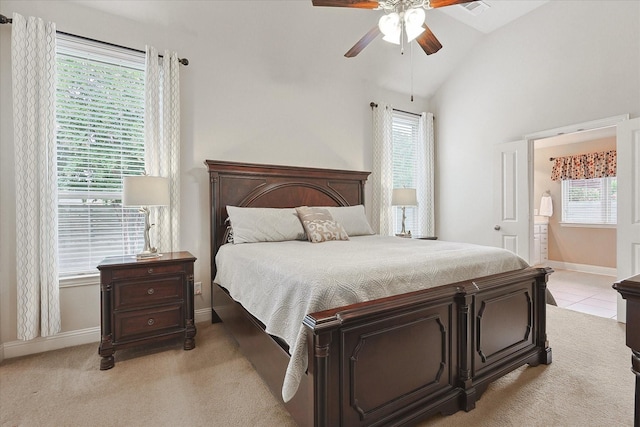 bedroom with multiple windows, vaulted ceiling, light carpet, and ceiling fan