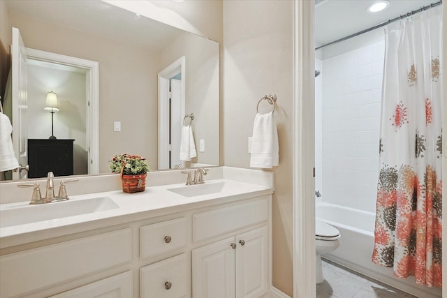 full bathroom featuring vanity, shower / bath combination with curtain, and toilet