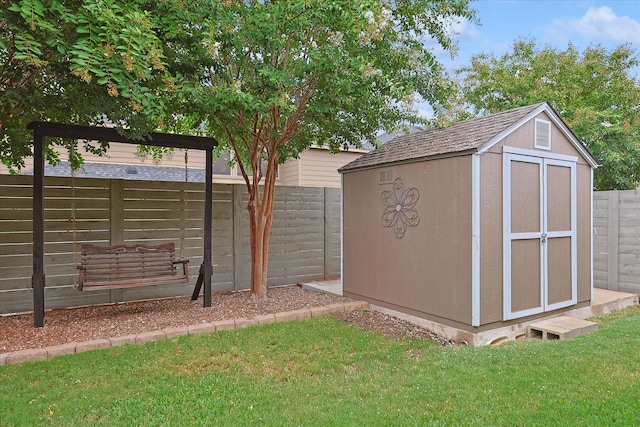 view of outbuilding featuring a yard