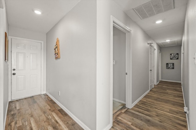 hallway with dark wood-type flooring