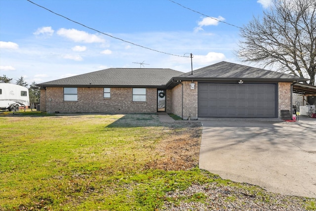 ranch-style house with a garage and a front lawn