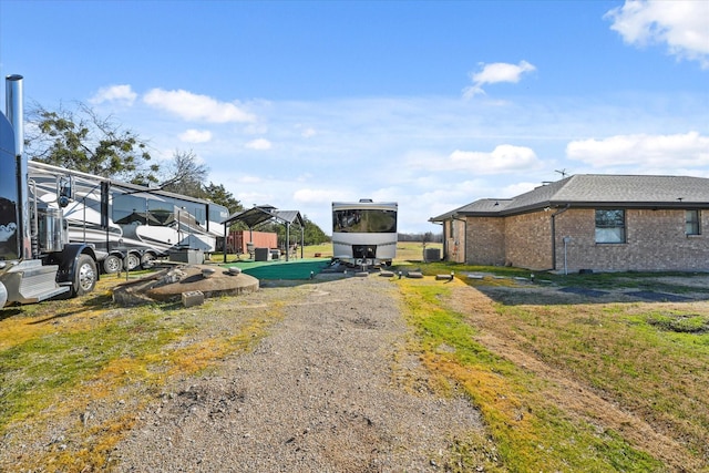 view of yard featuring a carport