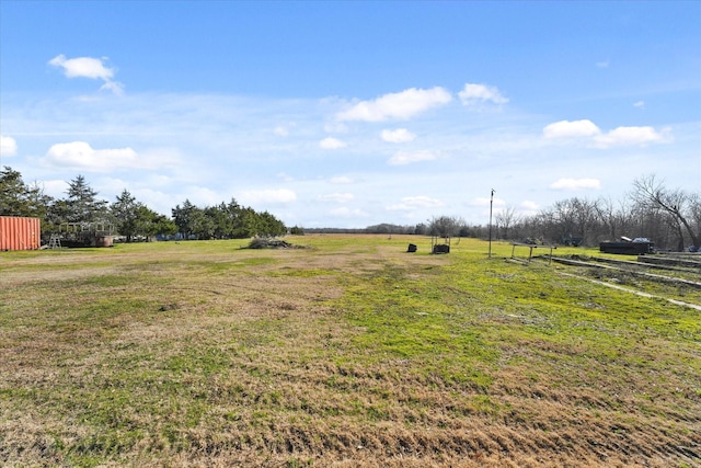 view of yard with a rural view