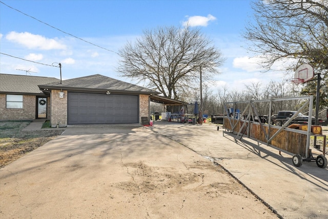 exterior space featuring a garage and a carport