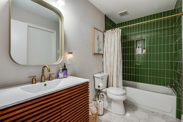 full bathroom featuring shower / bath combo, vanity, and toilet