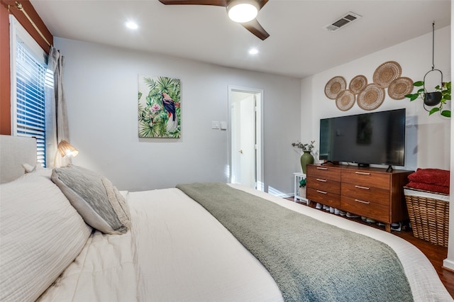 bedroom with hardwood / wood-style flooring and ceiling fan