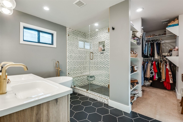 bathroom with vanity and separate shower and tub