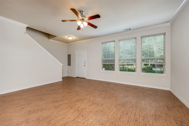 unfurnished living room with crown molding, ceiling fan, wood-type flooring, and electric panel