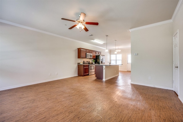 unfurnished living room with hardwood / wood-style floors, crown molding, ceiling fan with notable chandelier, and sink