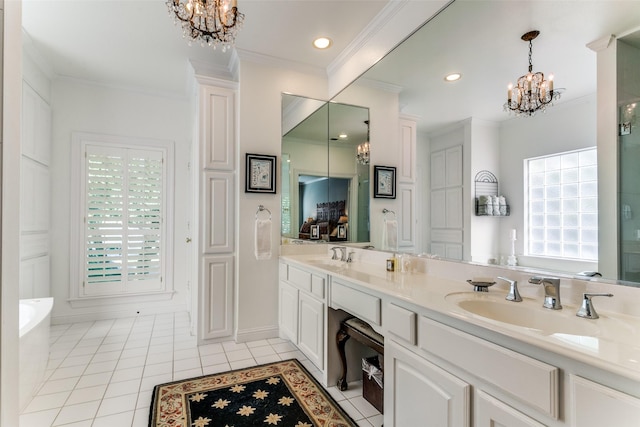 bathroom featuring crown molding, a bathtub, vanity, tile patterned floors, and a chandelier