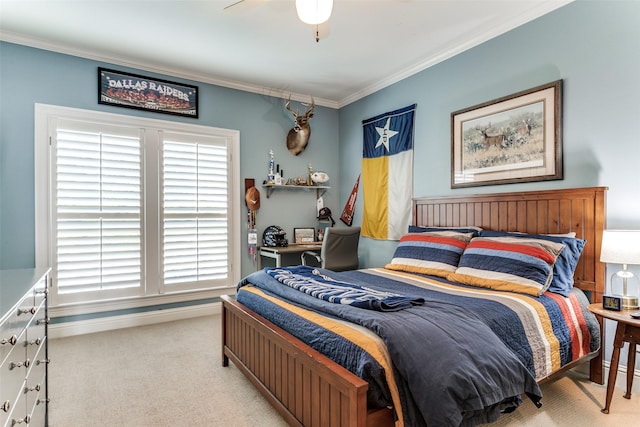 carpeted bedroom with crown molding and ceiling fan