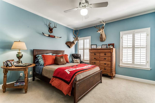 bedroom with crown molding, light carpet, and ceiling fan