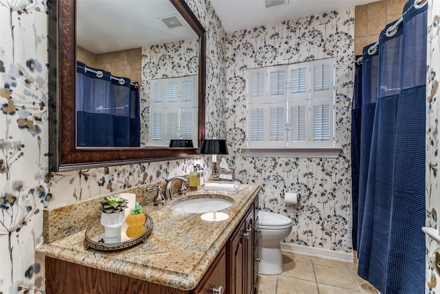 bathroom featuring tile patterned floors, toilet, a shower with shower curtain, and vanity