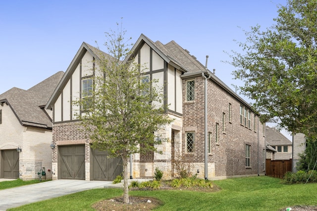 view of front of property featuring a garage and a front yard