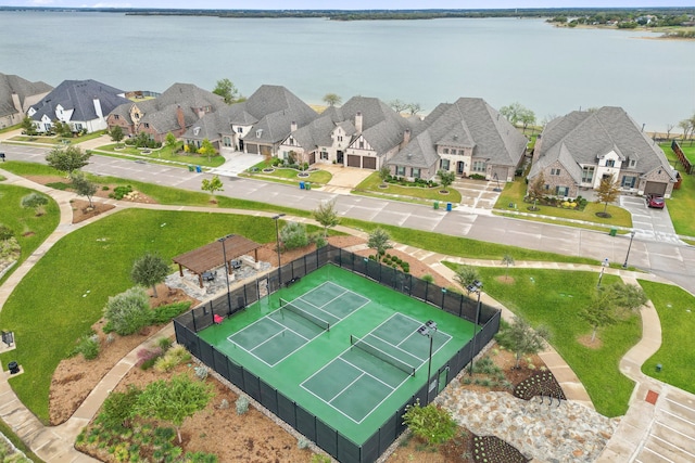 bird's eye view with a residential view and a water view