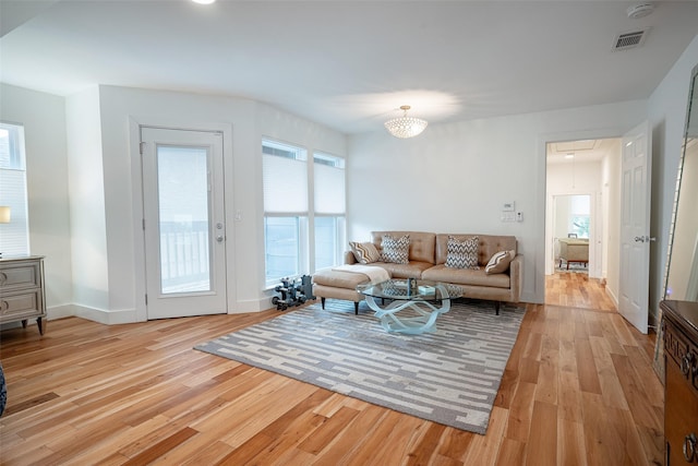 living room with light hardwood / wood-style flooring