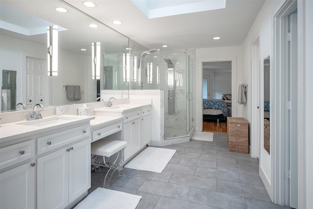 bathroom featuring vanity, tile patterned flooring, and walk in shower