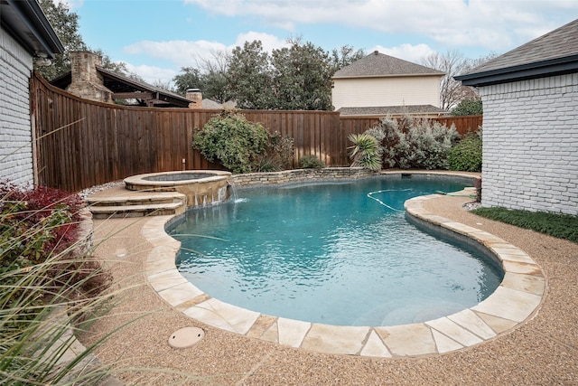 view of swimming pool with an in ground hot tub and pool water feature