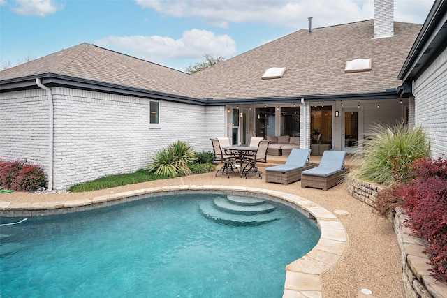 view of swimming pool with an outdoor hangout area and a patio