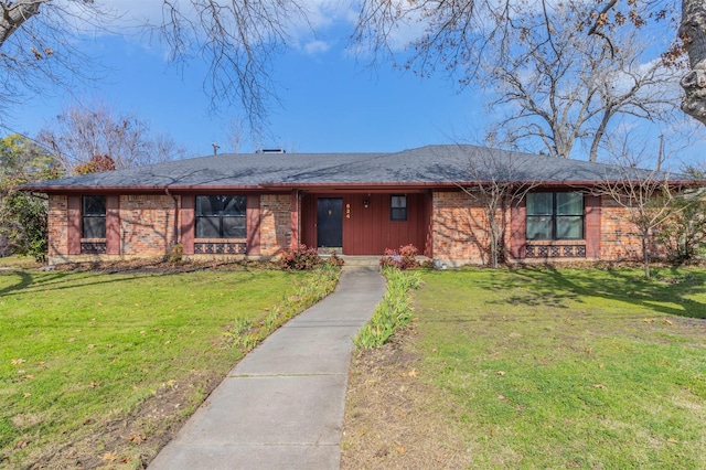 ranch-style house featuring a front lawn